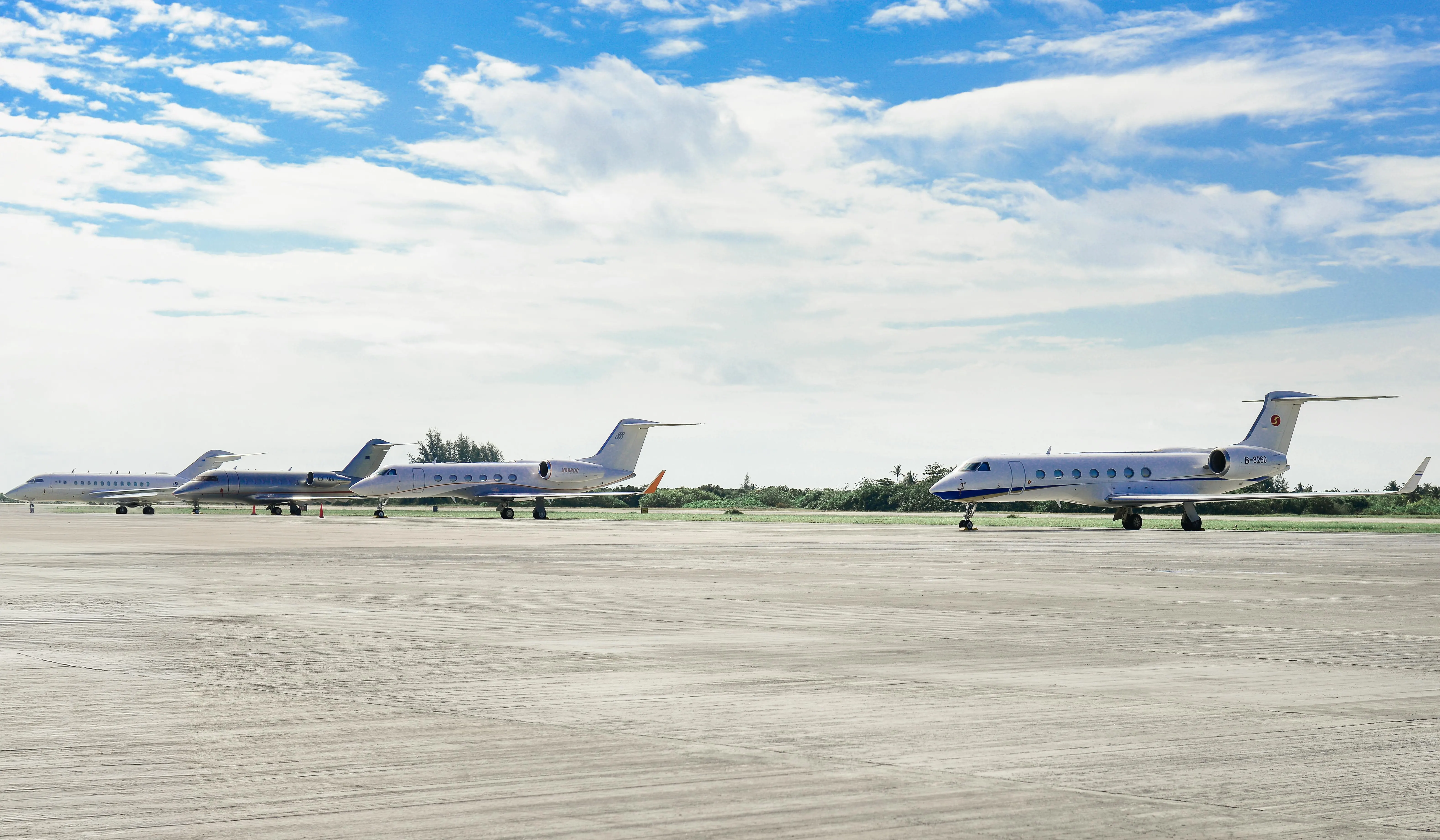 Business aircraft lined up on a ramp